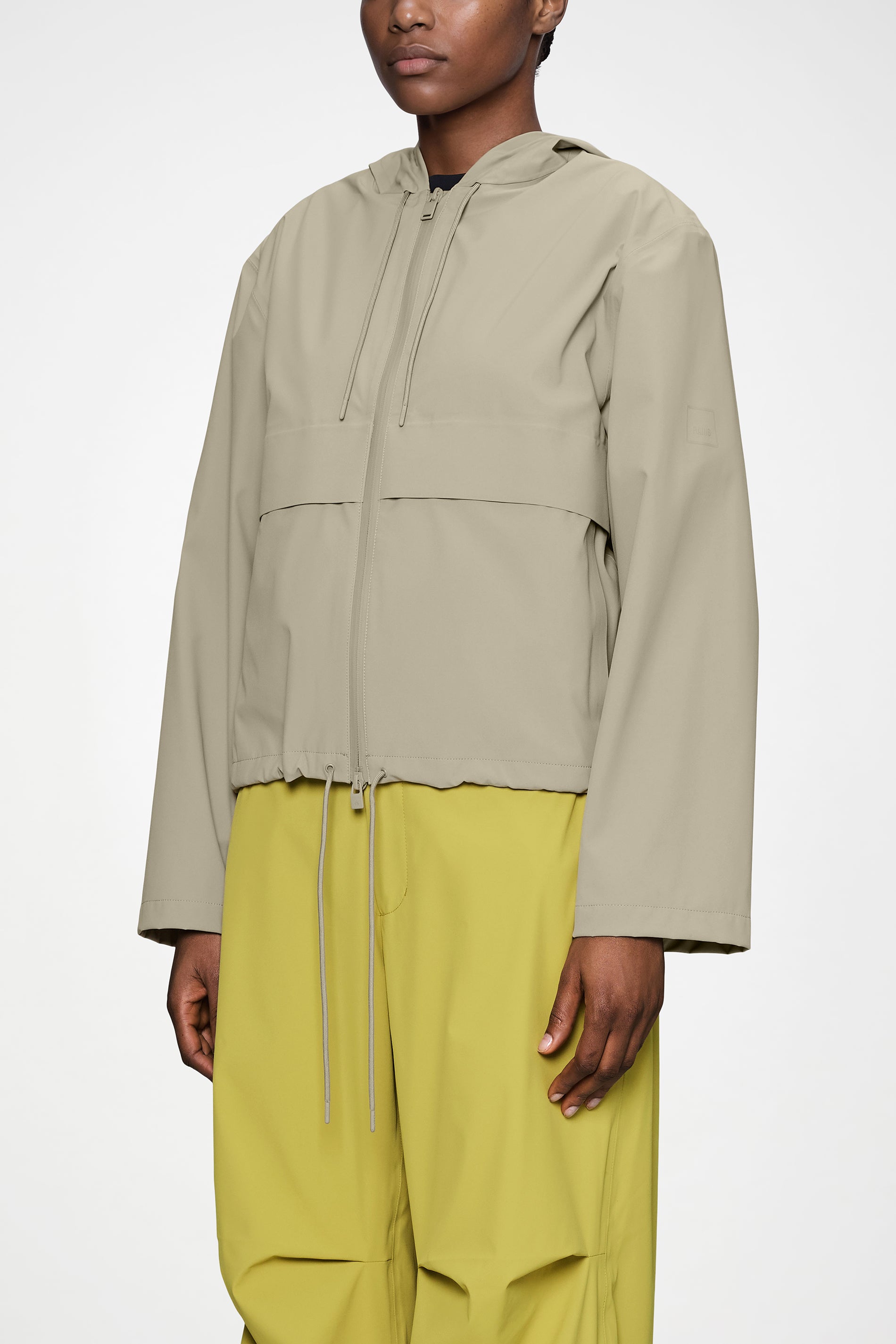 RAINS Suva Hardshell Short String W Jacket Beige Jacket